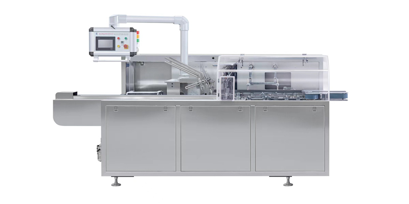 Drug packaging and cartoning machine